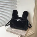Elegant black faux fur handbag featuring a silver turn-lock and adjustable strap. - Black (Without Charm)