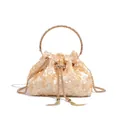 Detail view of champagne sequin bucket evening bag with rhinestone handle and tassel. - Sequin Style / Gold