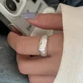 Macro view of minimalist silver ring featuring unique handcrafted tin foil texture - Handmade Foil-like Ring