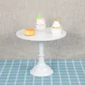 Elegant white round metal cake stand for elegant dessert and pastry display on blue table - Tall 30cm / White