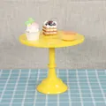 Bright yellow single-tier metal cake stand for dessert display on checkered cloth - Tall 30cm / Yellow