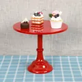Vibrant red metal cake stand displaying assorted desserts on a blue plaid tablecloth. - Tall 30cm / Red