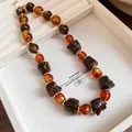 Vintage ethnic style amber and brown marbled bead necklace with gold spacers - Necklace-Coffee