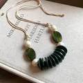 Vintage ethnic style green agate stone and cream bead long necklace on a beige cord - Necklace-Green