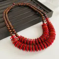Ethnic style layered necklace with brown wood beads and red discs on jewelry tray - Necklace-Red-Brown