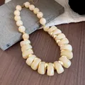 Ethnic style chunky marbled bead necklace with gold spacers in cream yellow finish - Necklace - Gold - Beige