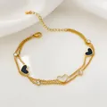 Double-layer 18K gold plated titanium steel bracelet with black and white heart charms - 18K Gold / White Heart