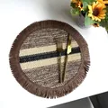 Round striped woven paper rope placemat with brown fringe and gold cutlery on table - Paper Stripe Coffee with Coffee Fringe (35cm Round)