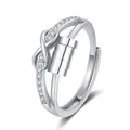 Close-up of a silver infinity spinner ring with zircon stones and rotating metal beads. - Adjustable Open / Infinity Pave - White Gold Color