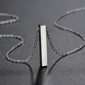 Detailed close-up view of a polished stainless steel 3D rectangular bar pendant necklace. - Steel