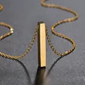 Close-up of a minimalist gold stainless steel 3D vertical bar pendant necklace - Gold