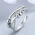 Close-up detail of infinity spinner ring featuring movable silver beads and S925 mark - Adjustable Open / Double-layer Cross Entwined - White Gold Color