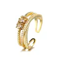 Elegant gold-plated fidget spinner ring with infinity motif and cubic zirconia. - Adjustable Open / Luck Turn - Gold Color