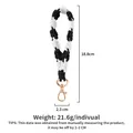 Hand-woven black and white floral phone lanyard with dimensions and weight details - Black and White