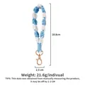 Handmade blue and white woven phone lanyard with gold clasp measuring 18.8cm in length - Blue White