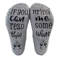 Detailed close-up of grey coral fleece socks featuring non-slip wine glass print sole - One Size / Gray