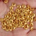 Macro view of detailed 18k gold-plated wheel spacer beads for DIY jewelry components. - 8mm Gold Laced Spacer Bead