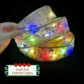 Festive gold foil LED ribbon string lights with star patterns for Christmas tree decoration - 5cm Width - 2m 20 LEDs - 2AA Battery Case / Gold Ribbon - Colored Light