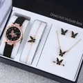 Vue détaillée d'une montre à quartz et parure papillon en noir et or rose pour femme. - Montre Noire et Ensemble de Bijoux Papillon
