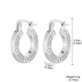 Detailed view of silver-tone hoop earrings featuring paved crystals and screw motifs - 2-25239A-5000