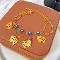 Dettaglio ravvicinato del bracciale oro a doppio strato con perle malocchio ed elefanti - Stile Malocchio ed Elefante (X1653)