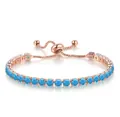 Detailed close-up of an adjustable rose gold bracelet with 4mm round blue zirconia - December Turquoise Blue