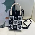 Stylish black and white knit mobile phone bag featuring C logo and camellia pattern. - Silicone Phone Case #13
