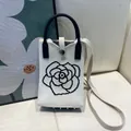 Stylish knitted crossbody phone bag with black camellia flower embroidery in white. - Silicone Phone Case #14