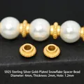 Close-up of gold-plated S925 silver ridged spacer beads for DIY jewelry making - Diameter 4mm Snowflake Spacer (JHF63423)
