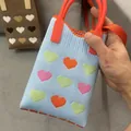 Handheld light blue knitted mini tote bag with colorful hearts and orange handles - Silicone Phone Case #21