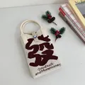 Minimalist knitted tote phone bag with festive Goodluck and Moremoney slogan design - Silicone Phone Case #28