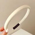 Serre-tête en éponge rembourré blanc crème avec design haut pour un style élégant. - Blanc Cassé Poli