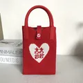 Handcrafted red knit tote bag featuring a white heart with Double Happiness symbol - Silicone Phone Case #41