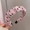 Serre-tête rembourré rose avec nœuds noirs pour un look élégant et volumineux - Style Plissé Nœud Rose