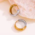 Detailed macro view of minimalist two-tone 18K gold and silver stainless steel hoop earrings - Round / 10mm / Gold and Silver Two-tone