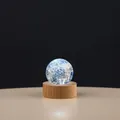 Elegant glowing galaxy crystal ball night light on a solid round wooden base. - Light Blue Sphere With Base