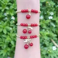 Handmade red cherry charm bead bracelet set with gold-plated accents worn on wrist - Cherry Charm 3-Piece Set (D1)
