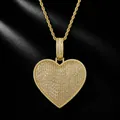 Close-up of gold iced out heart pendant necklace with baguette cubic zirconia stones - Gold Color (includes A 3mm 24-inch Stainless Steel Twisted Chain)