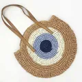 Round woven straw shoulder bag with evil eye pattern and brown leather straps for beach. - Evil Eye Design (Khaki Handle)