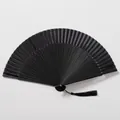 Elegant all-black Chinese folding fan featuring lacquered ribs and a matching silk tassel - Solid Black Style (All Black Non-hollowed Fan)