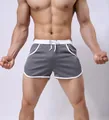 Grey athletic mesh shorts for men with contrasting white trim and adjustable drawstring - M / Gray