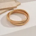 Minimalist golden snake bone tubogas bracelet in a multi-layered design for elegant style. - Double Wrap Spiral Choker / 3488 Gold