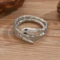 Elegant silver snake wrap bracelet featuring sparkling crystal details on wood background. - Silver Pave Rhinestone Snake Jewelry / 3493 Silver