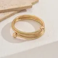 Minimalist gold multi-layer snake bone bracelet with decorative ball ends design - Triple Spiral Gold Bracelet / 3498 Gold