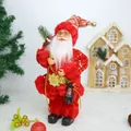 Traditional Santa Claus figurine with red sequined suit and a decorative lantern - Red Santa Claus