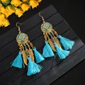 Bohemian style long tassel earrings with feather pendants and blue enamel detail - Totem Pattern Blue
