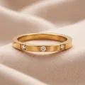 Elegant rose gold stainless steel band ring with three clear cubic zirconia stones - 9-3 Gold / Size 5