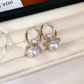 Eleganti orecchini a cerchio vintage francesi con grandi perle bianche e nodi di cristallo - Bianco