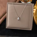 Minimalist silver titanium steel necklace with a smooth, polished teardrop pendant. - Waterdrop Pendant (H492)