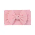 Soft pink high-elasticity nylon baby headband featuring a large decorative bow accessory. - Pink